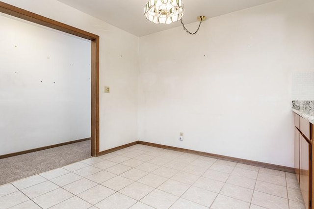 1322 Empire Ct, Freeport, IL 61032 - spare room with a chandelier and baseboards