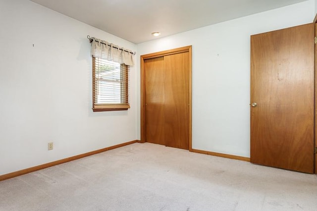 1322 Empire Ct, Freeport, IL 61032 - unfurnished bedroom with carpet, baseboards, and a closet