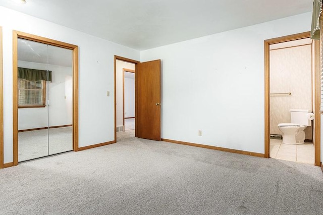 1322 Empire Ct, Freeport, IL 61032 - unfurnished bedroom with carpet flooring, baseboards, a closet, and ensuite bath