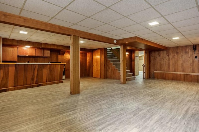 1322 Empire Ct, Freeport, IL 61032 - finished below grade area with wood walls, wood finished floors, stairs, a drop ceiling, and bar area