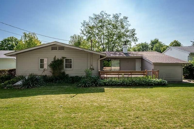 1322 Empire Ct, Freeport, IL 61032 - view of front of property with a front lawn, a wooden deck, and a chimney