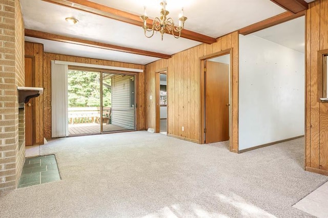 1322 Empire Ct, Freeport, IL 61032 - unfurnished living room with beam ceiling, wooden walls, carpet, a chandelier, and a fireplace