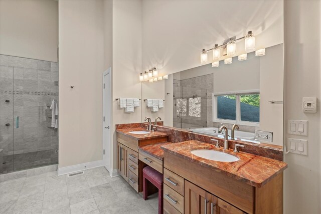 15629 W 139th St, Homer Glen, IL 60491 - bathroom featuring a stall shower, double vanity, a garden tub, and baseboards