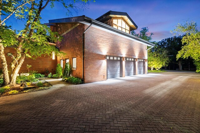 15629 W 139th St, Homer Glen, IL 60491 - garage at dusk featuring driveway
