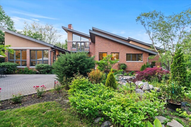 15629 W 139th St, Homer Glen, IL 60491 - rear view of property featuring brick siding and a chimney
