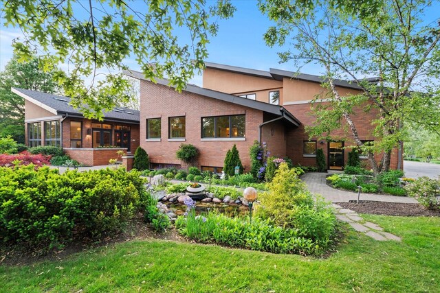 15629 W 139th St, Homer Glen, IL 60491 - mid-century home with brick siding, a sunroom, and a front lawn