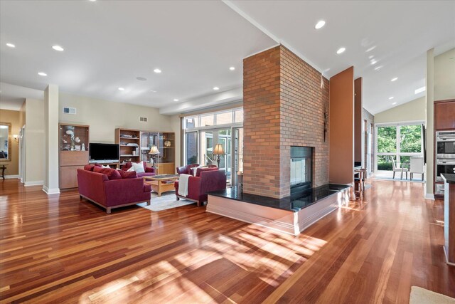 15629 W 139th St, Homer Glen, IL 60491 - living room with a fireplace, wood finished floors, recessed lighting, baseboards, and high vaulted ceiling