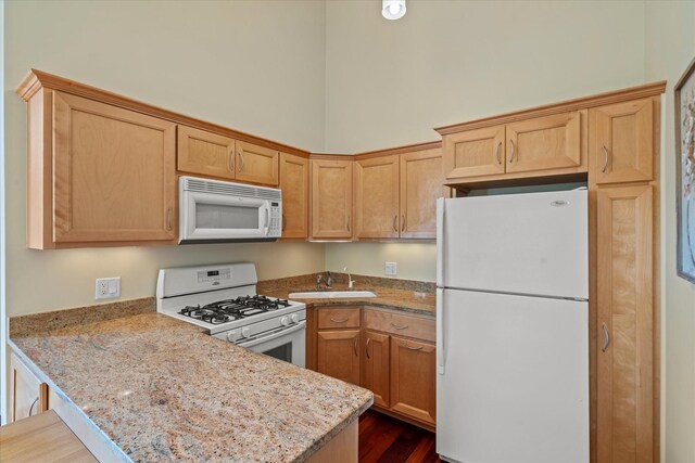 15629 W 139th St, Homer Glen, IL 60491 - kitchen with white appliances, a sink, a peninsula, dark wood-style flooring, and light stone counters
