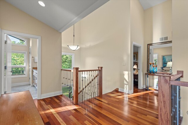 15629 W 139th St, Homer Glen, IL 60491 - corridor with an upstairs landing, plenty of natural light, wood finished floors, high vaulted ceiling, and baseboards