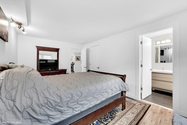 8758 W Berwyn Ave Unit 2N, Chicago, IL 60656 - bedroom with wood finished floors and connected bathroom