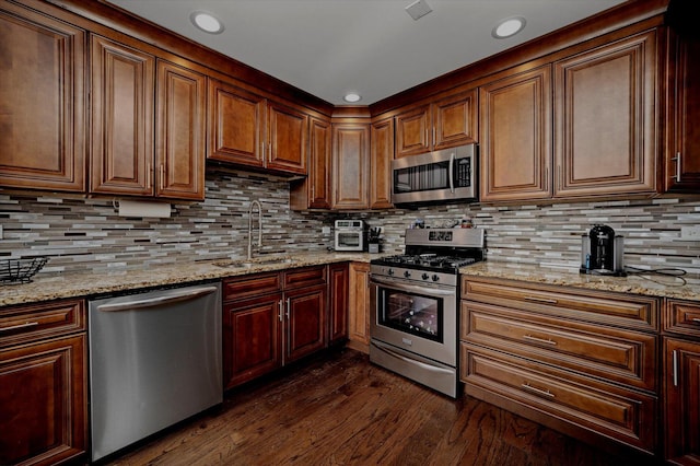 8771 Waterfront Dr Unit 3A, Palos Hills, IL 60465 - kitchen featuring stainless steel appliances, a sink, dark wood-style flooring, light stone counters, and recessed lighting