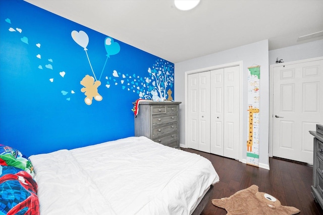 8771 Waterfront Dr Unit 3A, Palos Hills, IL 60465 - bedroom featuring dark wood-style floors, baseboards, a closet, and an accent wall