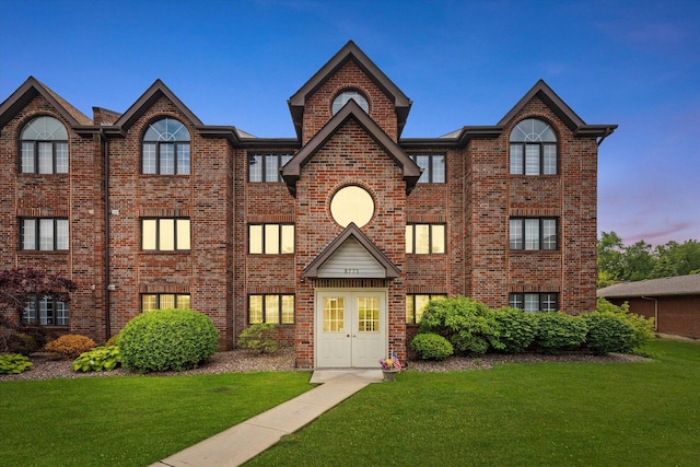 8771 Waterfront Dr Unit 3A, Palos Hills, IL 60465 - view of front of property featuring brick siding and a yard