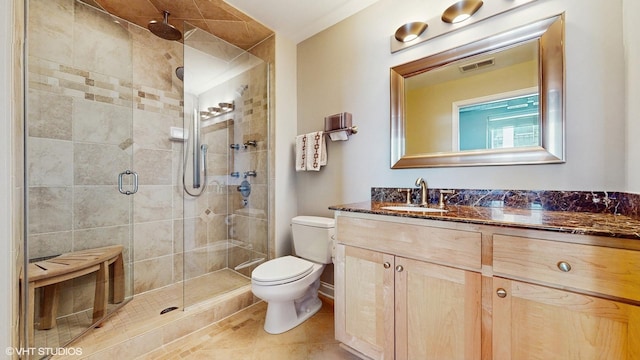 2025 S Indiana Ave Unit 503, Chicago, IL 60616 - full bathroom with toilet, vanity, a shower stall, and tile patterned floors