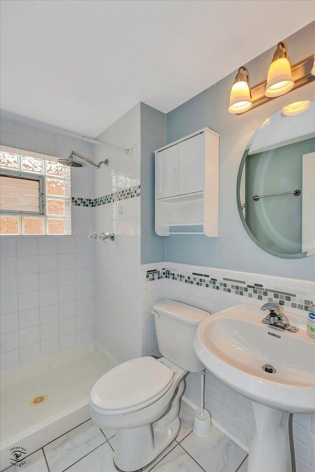 16560 Currant Ave, Tinley Park, IL 60487 - full bathroom with a shower stall, tile walls, toilet, marble finish floors, and a sink