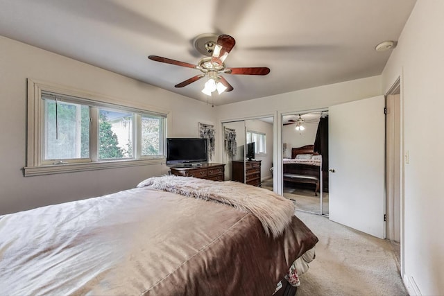 311 S Vine Ave Unit C, Park Ridge, IL 60068 - bedroom featuring light carpet, two closets, and a ceiling fan