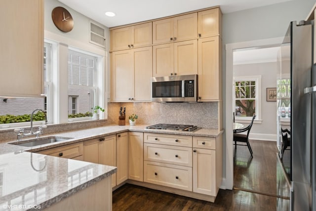 310 Fairview Ave, Winnetka, IL 60093 - kitchen featuring appliances with stainless steel finishes, a sink, light brown cabinetry, light stone countertops, and recessed lighting