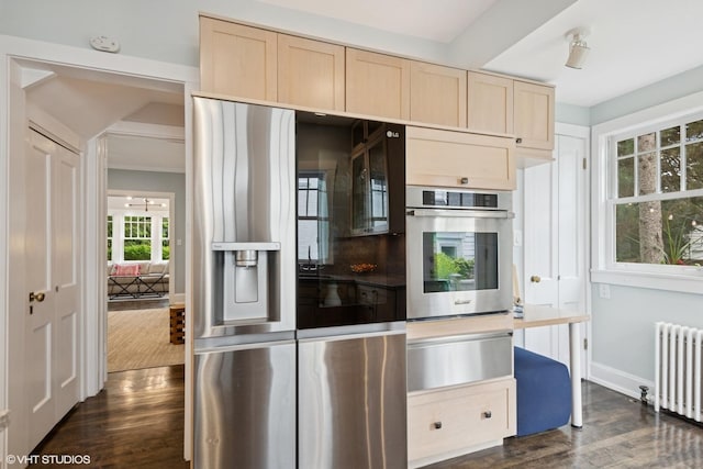 310 Fairview Ave, Winnetka, IL 60093 - kitchen featuring stainless steel appliances, a warming drawer, radiator, light brown cabinets, and dark wood-style flooring