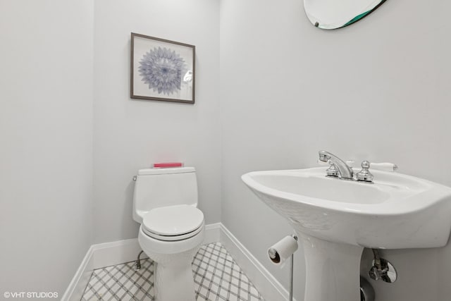 310 Fairview Ave, Winnetka, IL 60093 - half bathroom featuring toilet and baseboards