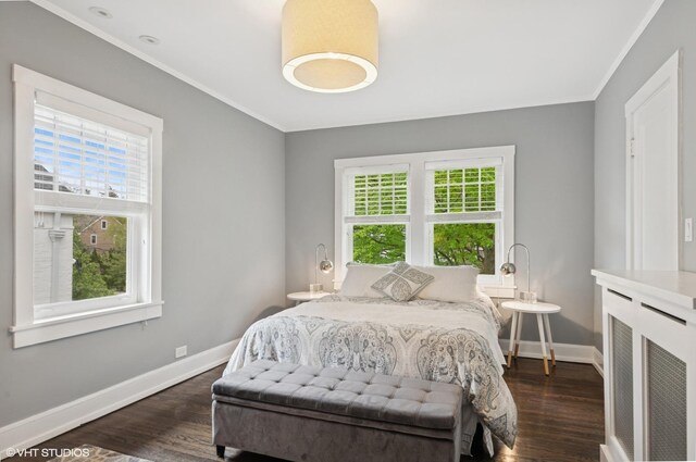 310 Fairview Ave, Winnetka, IL 60093 - bedroom featuring multiple windows, baseboards, dark wood-style flooring, and ornamental molding