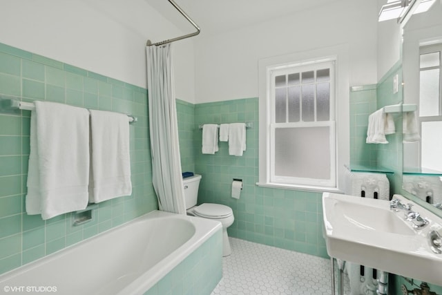 310 Fairview Ave, Winnetka, IL 60093 - full bathroom with tile walls, toilet, tile patterned flooring, a sink, and tiled shower / bath combo