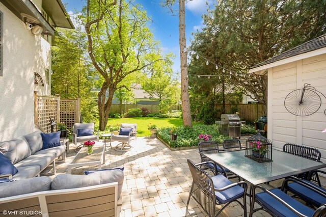 310 Fairview Ave, Winnetka, IL 60093 - fenced backyard featuring an outdoor hangout area, outdoor dining space, a patio, and grilling area