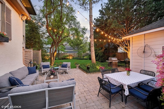 310 Fairview Ave, Winnetka, IL 60093 - fenced backyard with an outdoor hangout area, outdoor dining space, a patio, and area for grilling