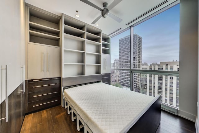 110 W Superior St Unit 1703, Chicago, IL 60654 - unfurnished bedroom with dark wood finished floors, multiple windows, expansive windows, a view of city, and recessed lighting