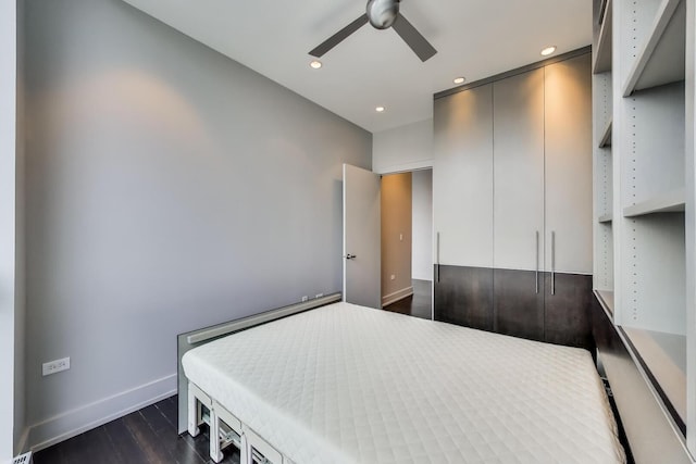 110 W Superior St Unit 1703, Chicago, IL 60654 - bedroom with baseboards, dark wood finished floors, recessed lighting, a ceiling fan, and a closet