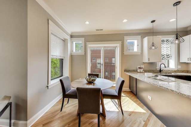 3706 W Wrightwood Ave Unit 3A, Chicago, IL 60647 - dining area featuring crown molding, baseboards, light wood finished floors, and recessed lighting