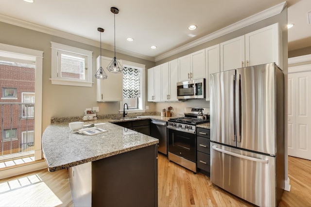 3706 W Wrightwood Ave Unit 3A, Chicago, IL 60647 - kitchen featuring stainless steel appliances, a peninsula, white cabinets, a sink, and light stone counters