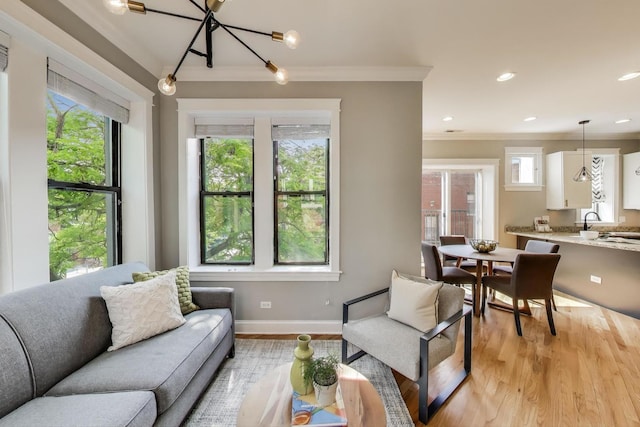 3706 W Wrightwood Ave Unit 3A, Chicago, IL 60647 - living area with ornamental molding, a chandelier, light wood-style floors, baseboards, and recessed lighting