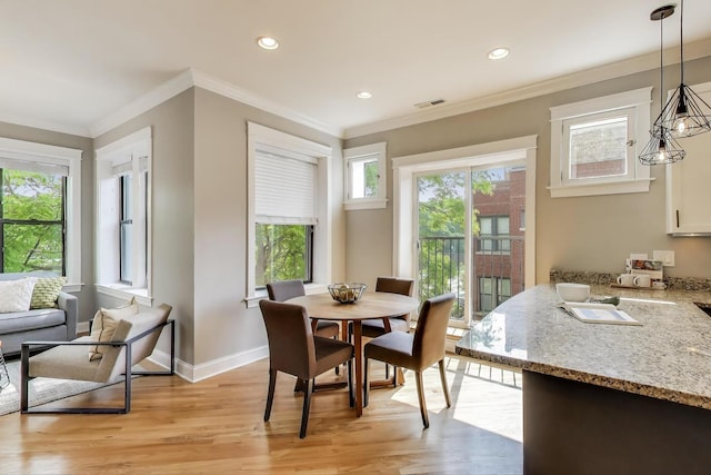 3706 W Wrightwood Ave Unit 3A, Chicago, IL 60647 - dining space featuring light wood finished floors, baseboards, crown molding, and recessed lighting