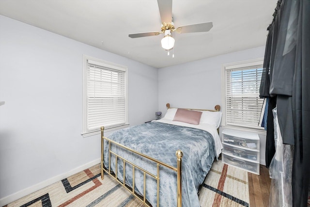 5106 W 64th St, Chicago, IL 60638 - bedroom with baseboards, wood finished floors, and a ceiling fan
