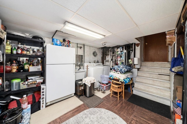 5106 W 64th St, Chicago, IL 60638 - finished below grade area with freestanding refrigerator, a paneled ceiling, separate washer and dryer, and stairs