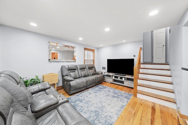 5106 W 64th St, Chicago, IL 60638 - living room with wood finished floors, stairs, and recessed lighting