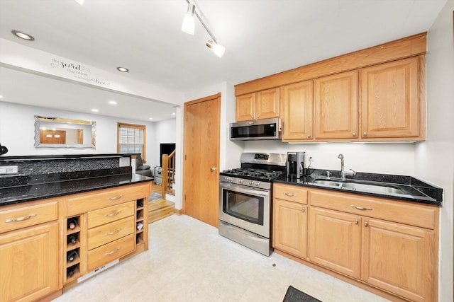 5106 W 64th St, Chicago, IL 60638 - kitchen featuring stainless steel appliances, dark stone countertops, open shelves, a sink, and light floors