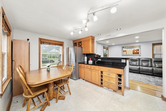 5106 W 64th St, Chicago, IL 60638 - kitchen with freestanding refrigerator, light floors, a peninsula, and open floor plan