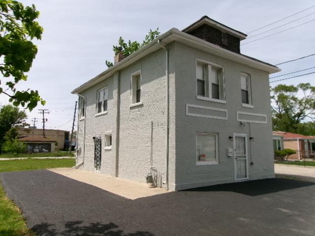 view of home's exterior featuring a chimney and a patio area
