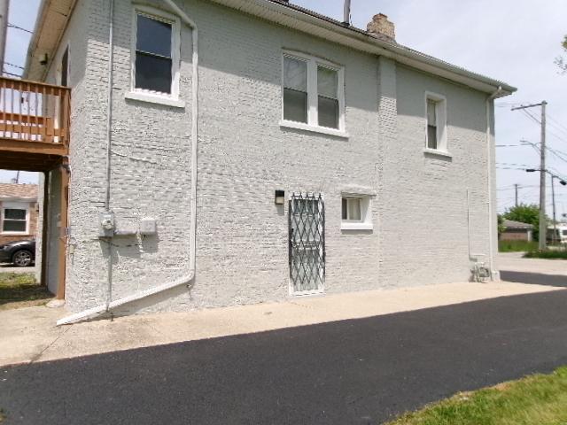 view of home's exterior with a chimney