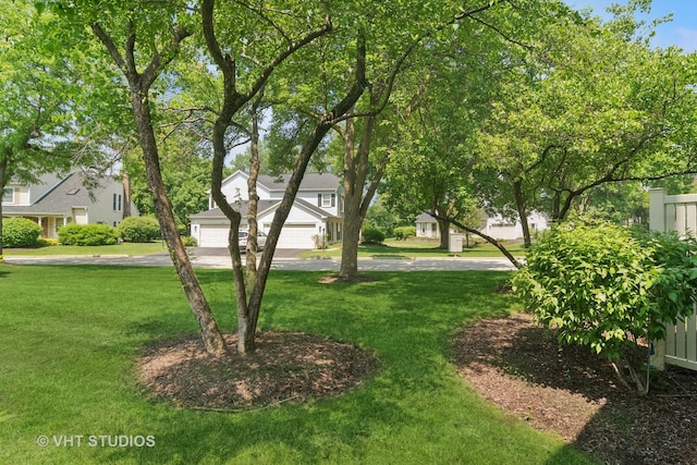 303 College Xing, Rolling Meadows, IL 60008 - view of grassy yard featuring driveway and a garage