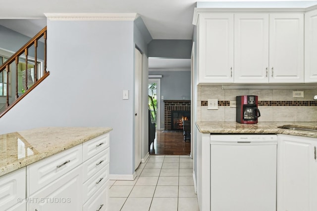 303 College Xing, Rolling Meadows, IL 60008 - kitchen featuring white dishwasher, decorative backsplash, light tile patterned flooring, white cabinetry, and crown molding