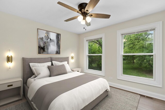 420 N E Gateway Dr, Tower Lakes, IL 60010 - bedroom with baseboards, wood finished floors, and a ceiling fan