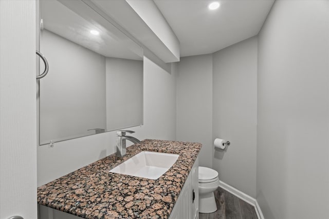 3601 S 57th Ct, Cicero, IL 60804 - half bathroom with toilet, vanity, wood finished floors, baseboards, and recessed lighting