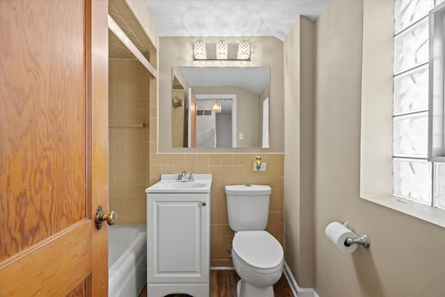 3601 S 57th Ct, Cicero, IL 60804 - full bathroom featuring vanity, toilet, bathing tub / shower combination, and tile walls