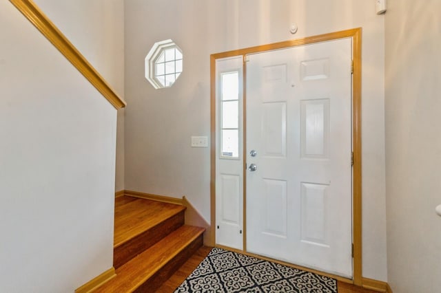 3856 Pathfinder Ln, Joliet, IL 60435 - entrance foyer featuring dark wood finished floors, stairway, and baseboards