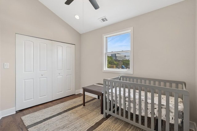 2415 W Washburne Ave, Chicago, IL 60608 - bedroom featuring lofted ceiling, baseboards, a closet, wood finished floors, and ceiling fan