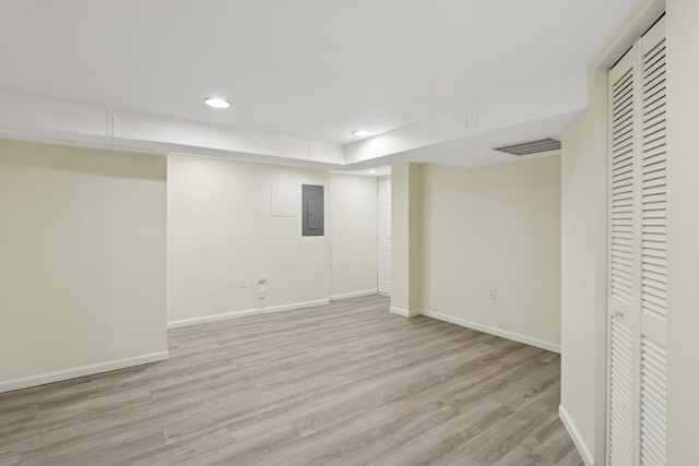 2415 W Washburne Ave, Chicago, IL 60608 - finished basement with electric panel, baseboards, recessed lighting, and light wood finished floors