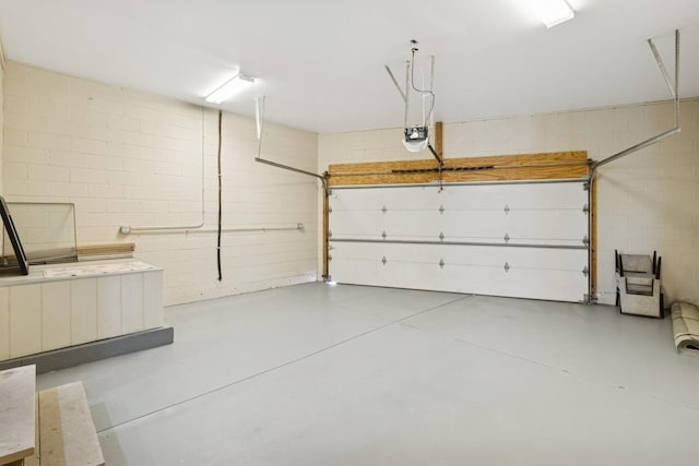 2415 W Washburne Ave, Chicago, IL 60608 - garage with a garage door opener and concrete block wall