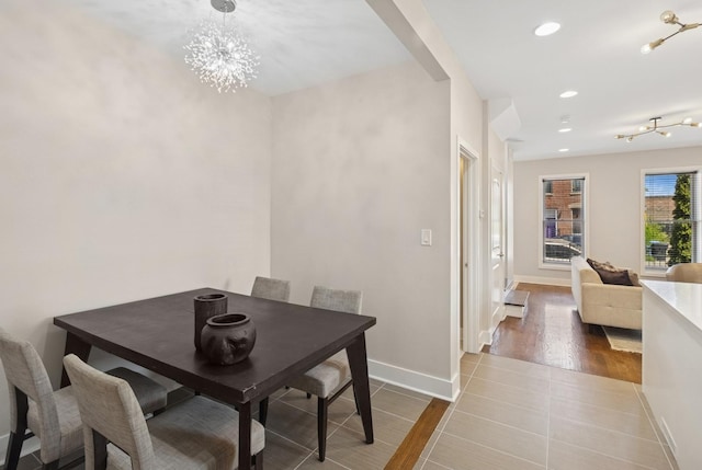 2415 W Washburne Ave, Chicago, IL 60608 - dining area featuring baseboards, recessed lighting, a chandelier, and wood finished floors
